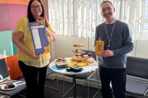 A photo of SCH staff with the cakes they made for charity.