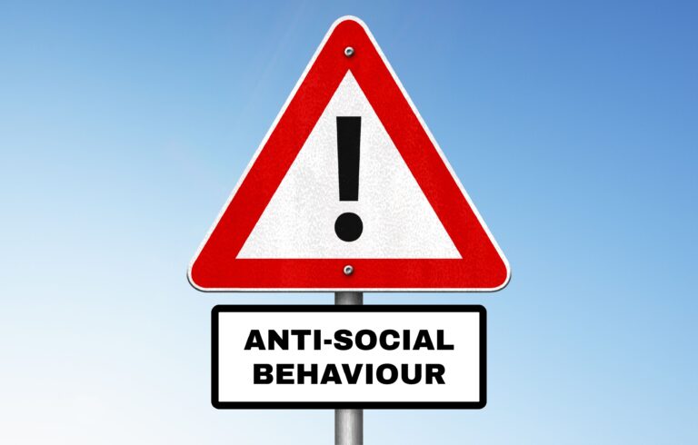 An image of a sign with an exclamation mark, which says "anti social behaviour" underneath.