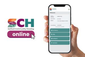 A hand holding a phone that's displaying the SCH Online home page